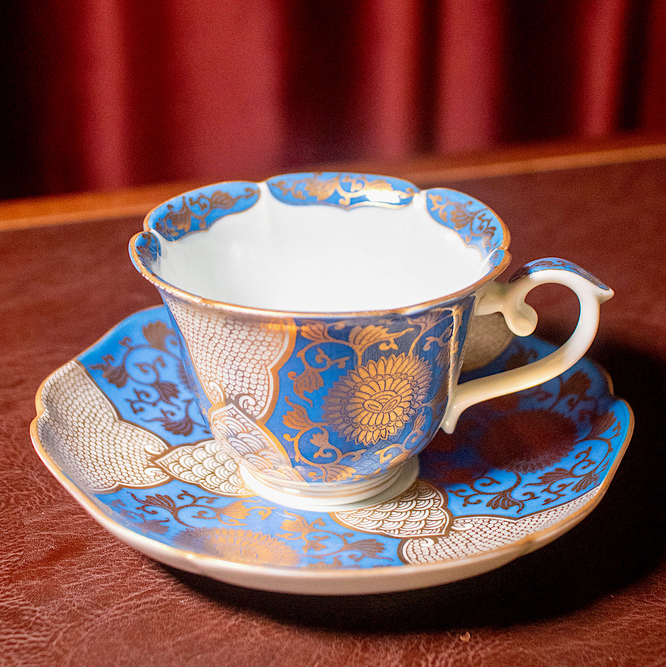 Blue and gold chrysanthemum flower tea cup and saucer set (Arita-ware)