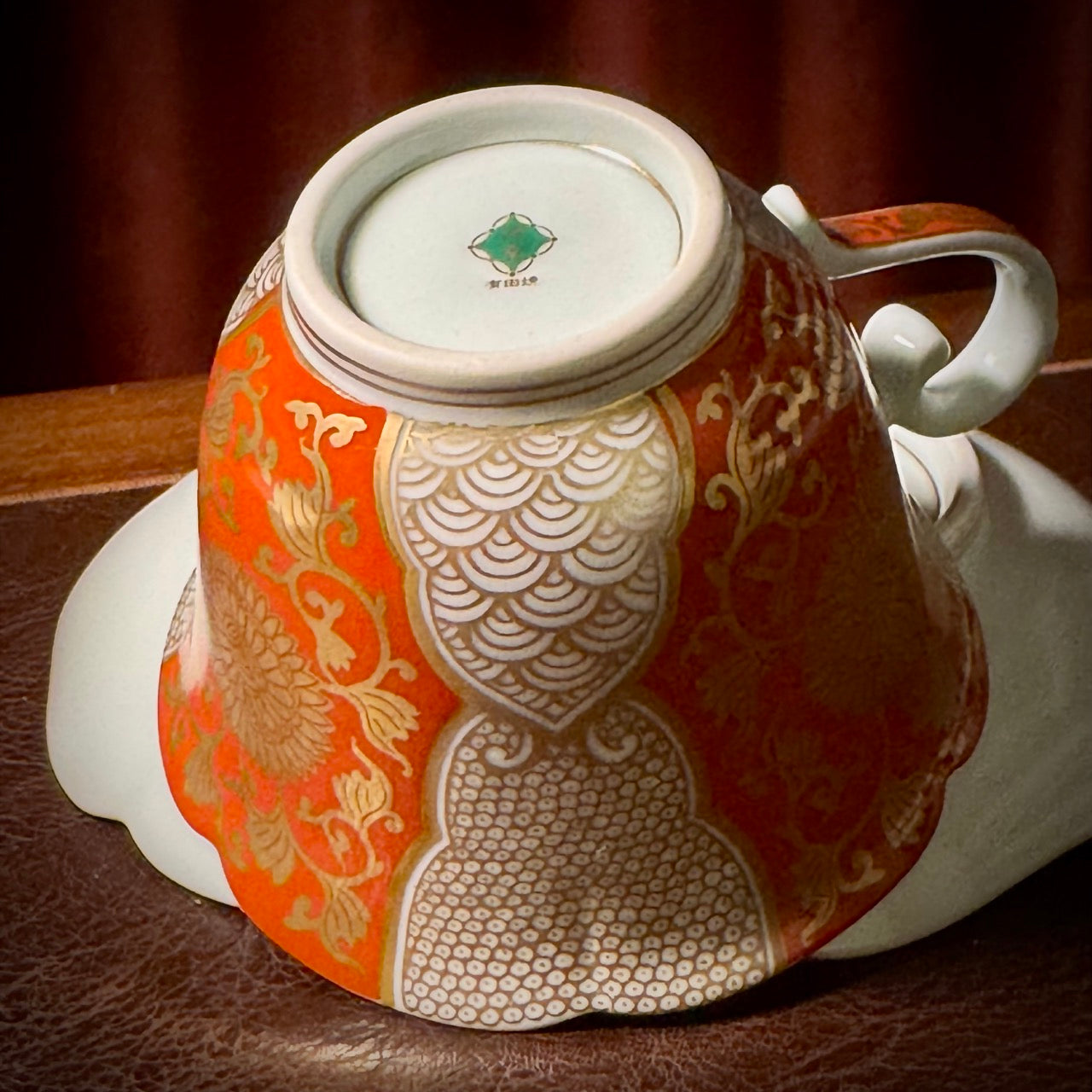 Red and gold chrysanthemum flower tea cup and saucer set (Arita-ware)