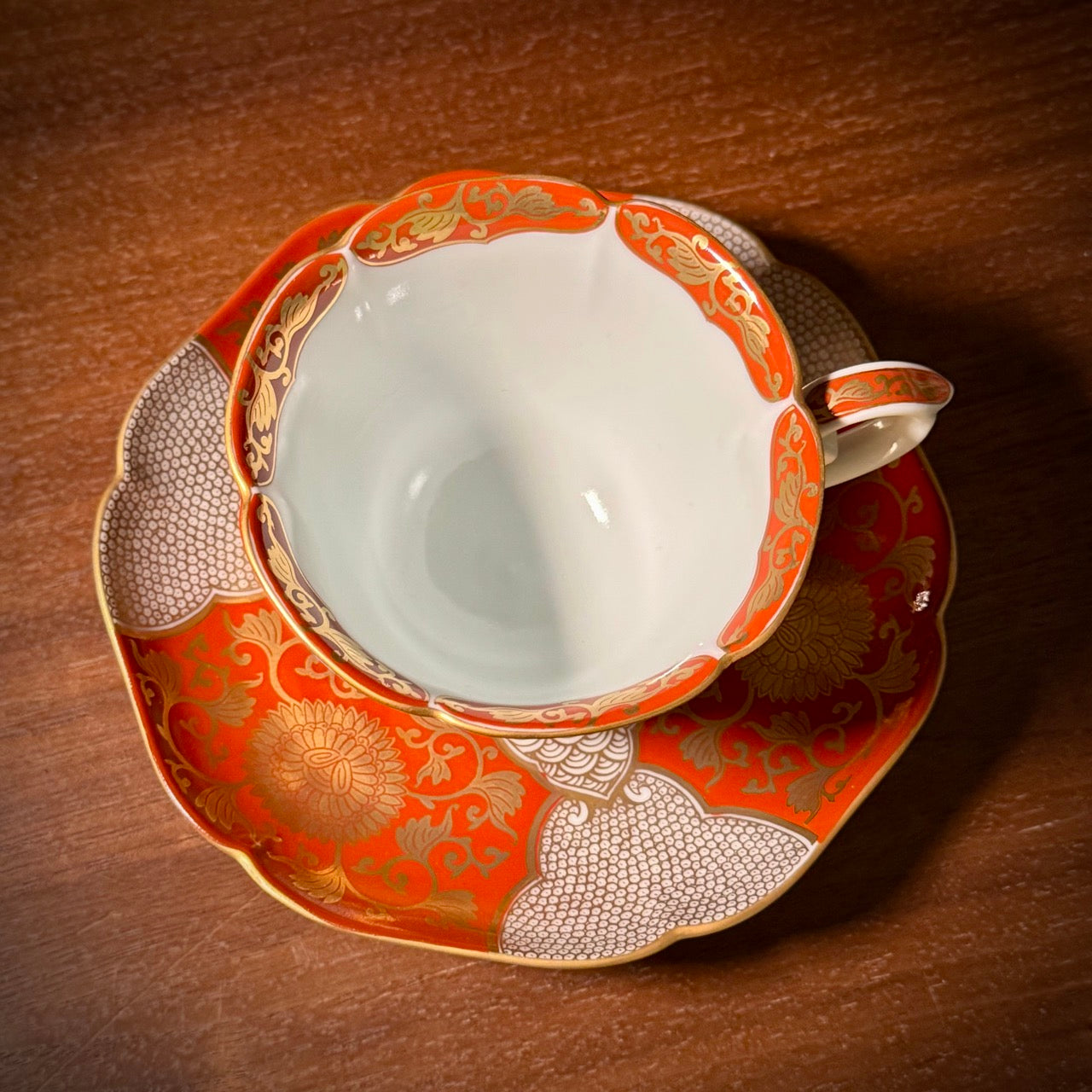 Red and gold chrysanthemum flower tea cup and saucer set (Arita-ware)